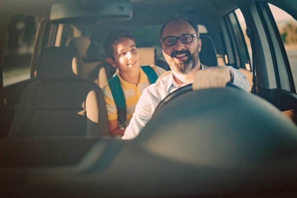 istock Father driving his son to school 1031393936