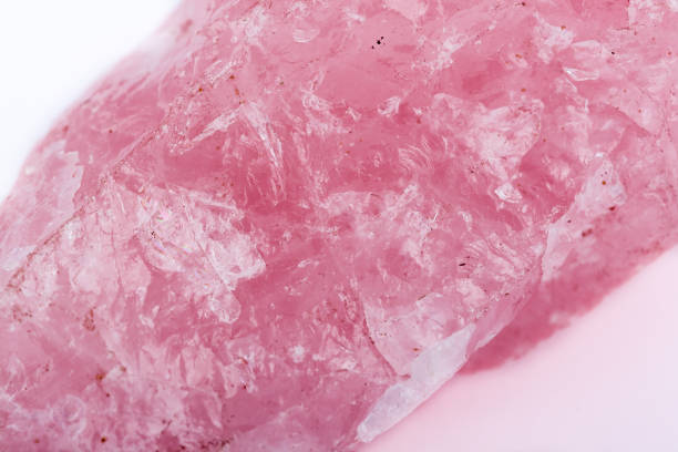 istock Macro mineral stone Pink quartz on a white background close up 1031397508
