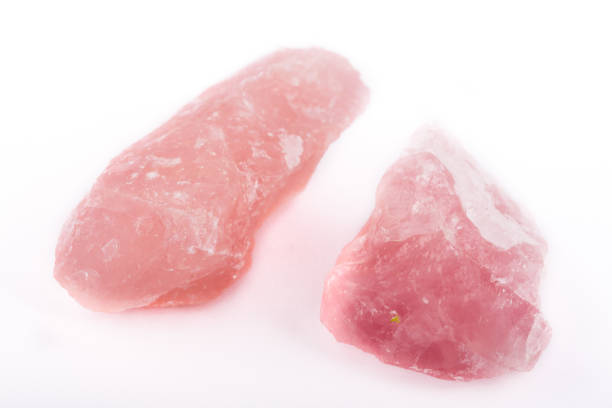 istock Macro mineral stone Pink quartz on a white background close up 1031397538