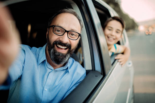 istock Father driving his son to school 1031398042