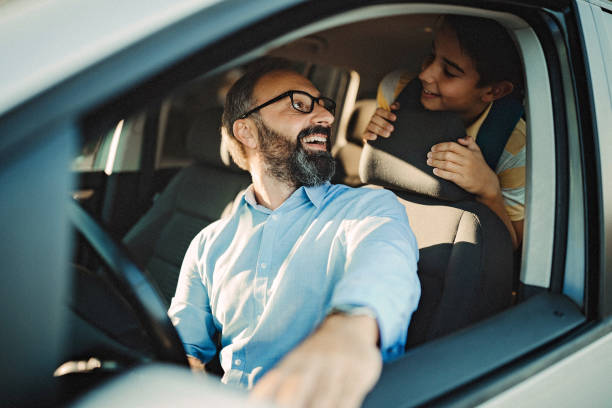 istock Father driving his son to school 1031401274