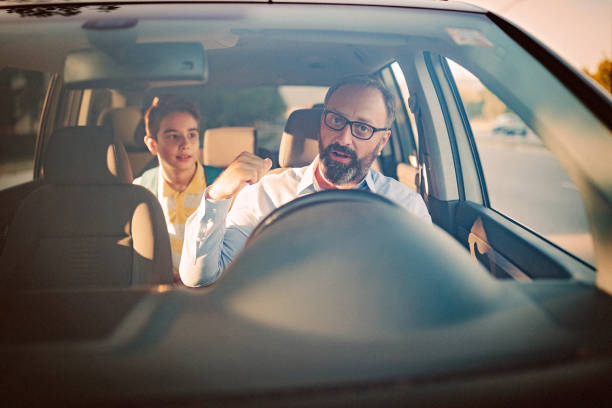 istock Father driving his son to school 1031404520