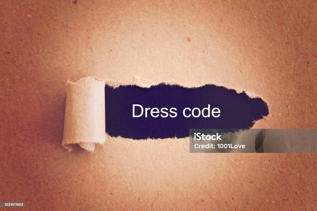 Dress Code Dress Code written under torn paper. Dress Code Stock Photo