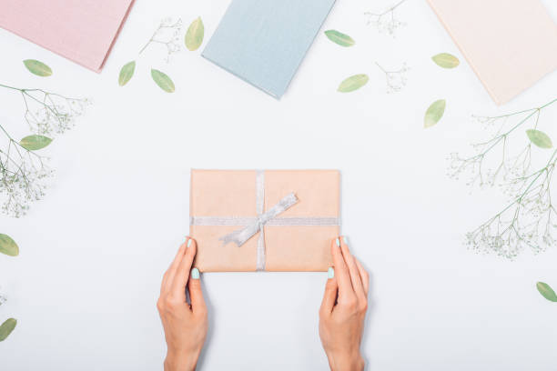 istock Festive flat lay composition with books, dry leaves and present 1031419218