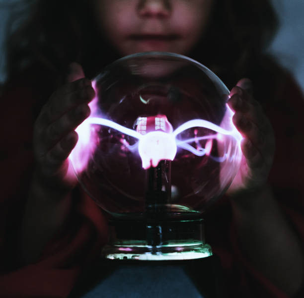 istock Little fortune teller with a plasma ball 1031426778