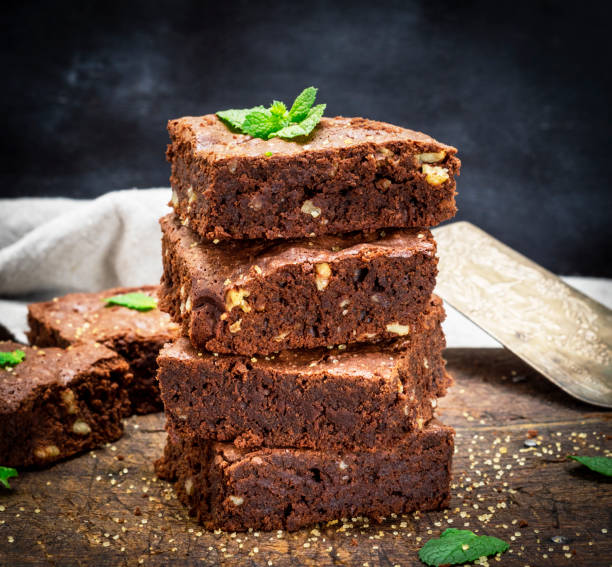 istock baked square pieces of chocolate brownie pie with walnuts 1031429618