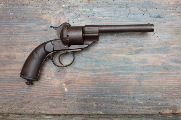 istock A historical pistol on vintage wooden table 1031429638