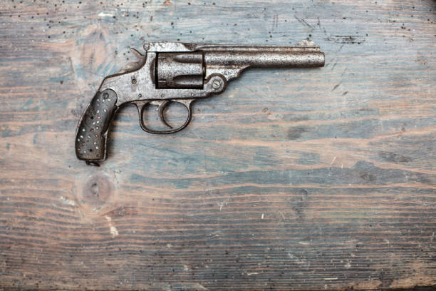 istock A historical pistol on vintage wooden table 1031429652