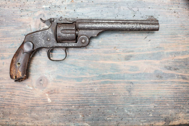 istock A historical pistol on vintage wooden table 1031429662