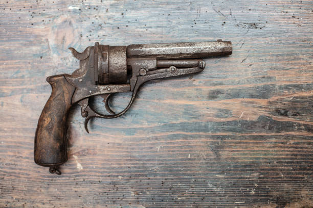 istock A historical pistol on vintage wooden table 1031429664