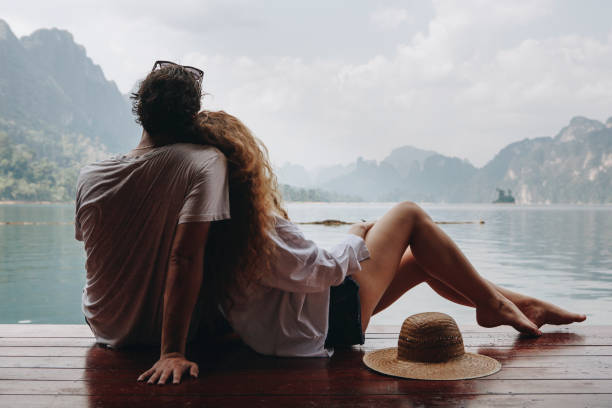 istock Woman relaxing in her boyfriends lap 1031436022