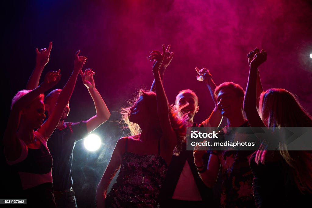 People at a party Group of teenagers having fun at nightclub Party - Social Event Stock Photo