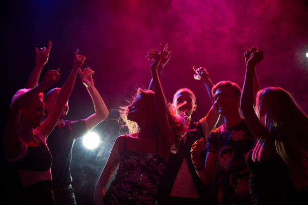 People at a party Group of teenagers having fun at nightclub disco dancing photos stock pictures, royalty-free photos & images
