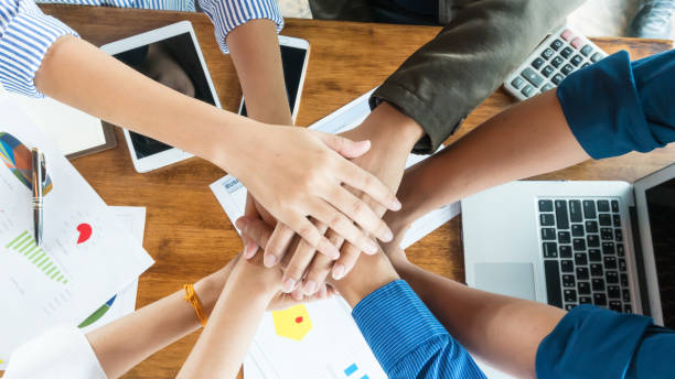 istock People in team harmonious hand meeting with worm light 1031437232
