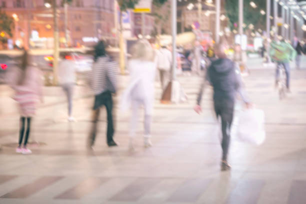 istock Abstract bright blurred background with unidentified people, defocused motion, blurred background, city street. Concept of seasons, modern city, urban lifestyle, leisure 1031437678