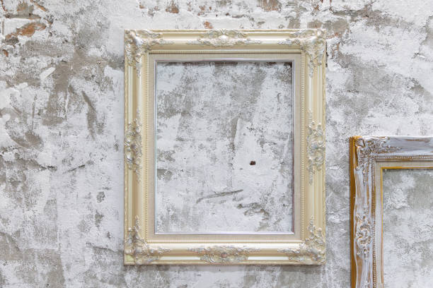 istock empty vintage photo frame on old dirty concrete wall. 1031445178