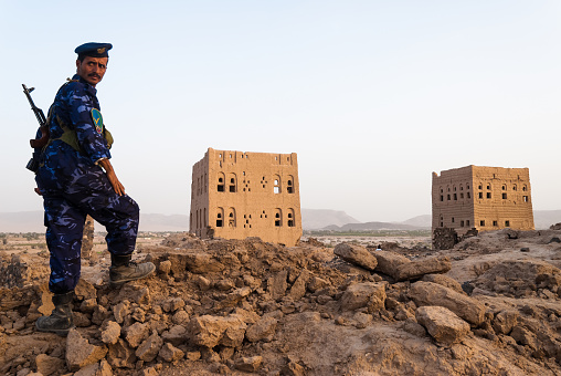 A heavily armed policeman guards an archaeological site on May 5, 2007 in the district of Marib, Yemen. Among other arabic countries, in 2012 Yemen became a site of civil conflicts, which still continue.