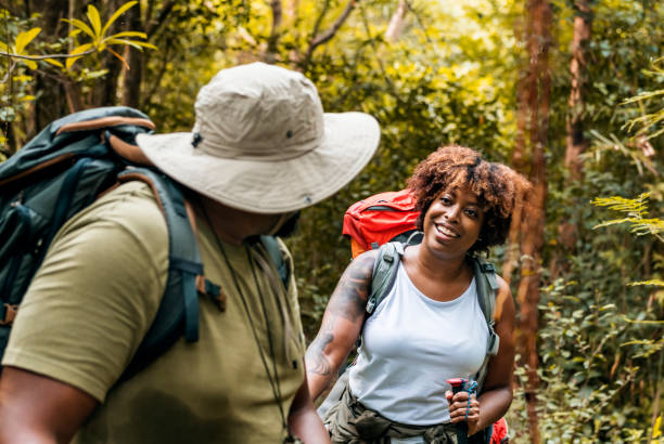 istock Couple trekking in the forest together 1031451482