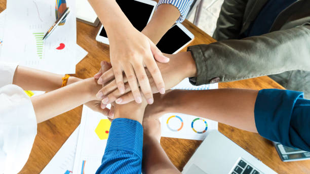 istock People in team harmonious hand meeting on top view. 1031453744