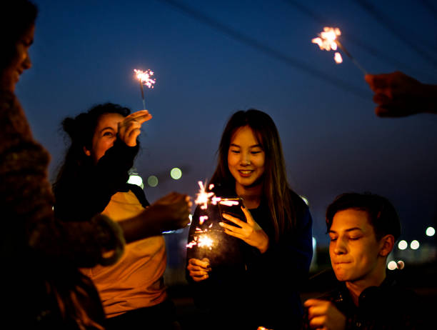 istock Group of school friends happiness and playing firework 1031454484