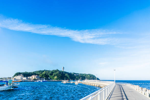 Asia travel concept - the famous travel place, enoshima island under dramatic blue sky in kamakura, Japan.
