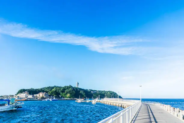 Asia travel concept - the famous travel place, enoshima island under dramatic blue sky in kamakura, Japan.