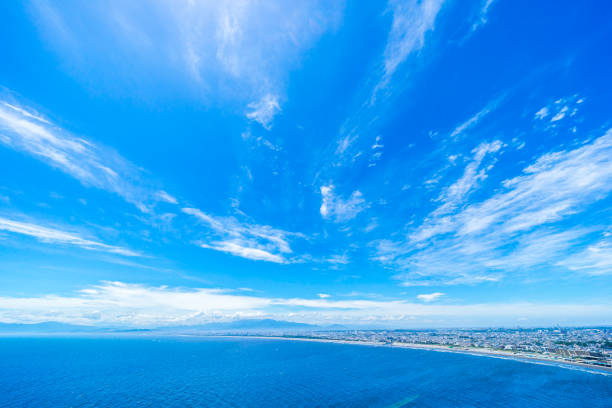 enoshima island and urban skyline aerial view in kamakura, Japan Asia travel concept -  the famous travel place, enoshima island and urban skyline aerial panoramic view under dramatic blue sky and beautiful ocean in kamakura, Japan. clear morning sky stock pictures, royalty-free photos & images