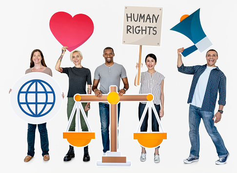 Diverse people holding human rights symbols ***These graphics are derived from our own designs. They do not infringe on any copyright design.