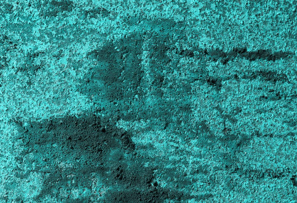 istock Old turquoise worn metal surface with paint background 1031471732
