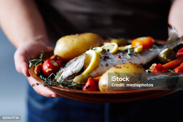 Appetizing Meal With Baked Fish Stock Photo - Download Image Now - Fish, Mediterranean Food, Food