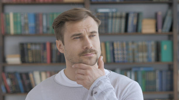 istock Portrait of Thinking Middle Aged Man in Office 1031471820