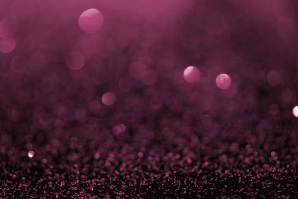 istock abstract background with purple glitter and bokeh 1031472492