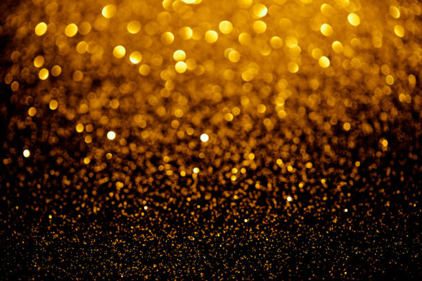 istock gold blurred glitter texture, holiday background 1031472812