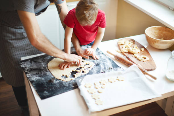 istock Father and son making cookies for Christmas 1031473000