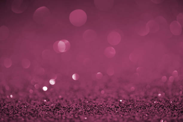 istock abstract purple glitter with bokeh on background 1031473818