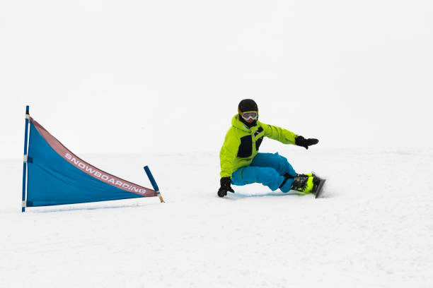 istock Front View of Young Snowboarder at Giant Slalom Practice 1031475998