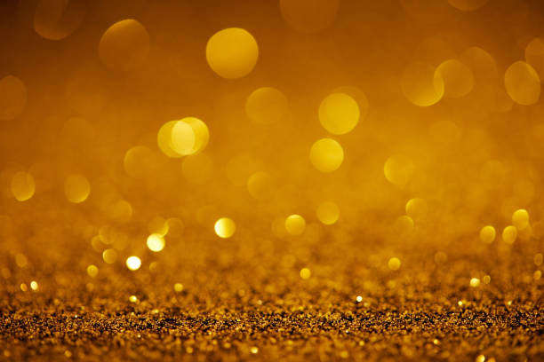 istock abstract golden glitter with bokeh on background 1031476124