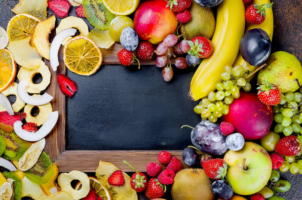 istock dried and raw fruits on dark background 1031476152