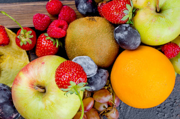 istock mixed many different seasonal fruits 1031476576