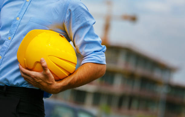 istock Close-up of architect holding hardhat 1031476836