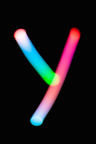 istock Letter Y. Glowing letters on dark background. Abstract light painting at night. Creative artistic colorful bokeh. New Year. Use it for build you own design for book cover, CD, poster or post card. 1031481830