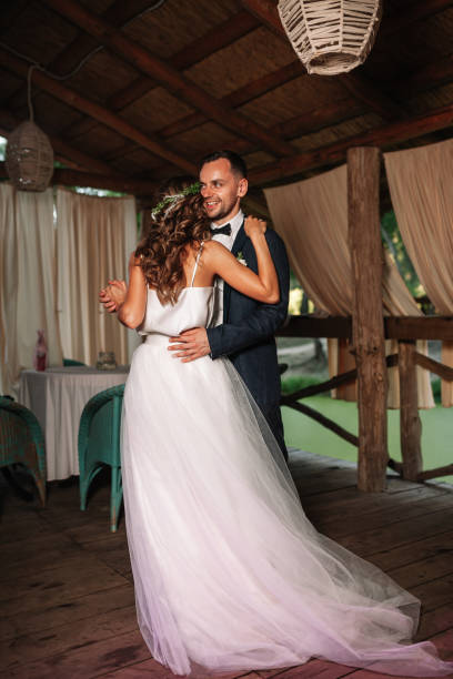 istock Happy bride and groom and their first dance, wedding in the elegant restaurant with a wonderful light and atmosphere 1031481864