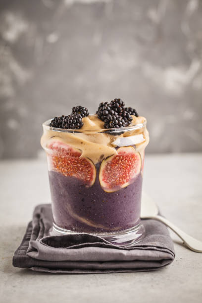 Figs and blackberries smoothie in glass jar. Go vegan concept.