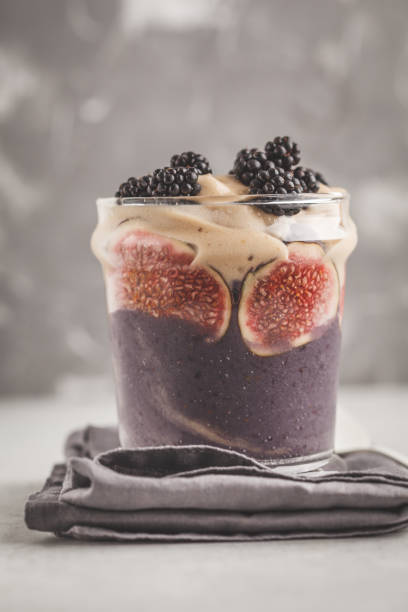 istock Figs and blackberries smoothie in glass jar. Go vegan concept. 1031484940