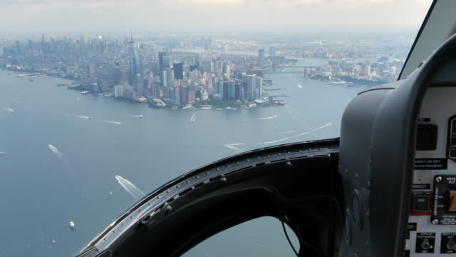 Helicopter Cockpit Views Flying Over Manhattan island in New York city