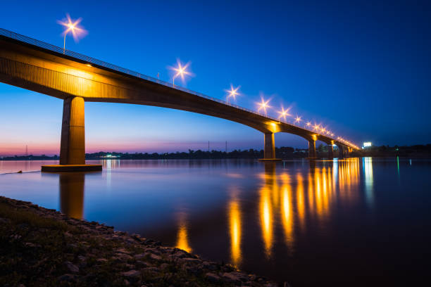 istock Thai-Laos Friendship Bridge on sunset background 1031488378