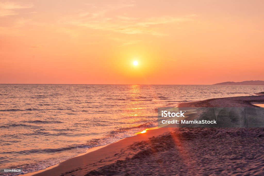 Beautiful cloudscape over the sea, sunset shot Horizontal shot of a sunset over the sea Sunset Stock Photo