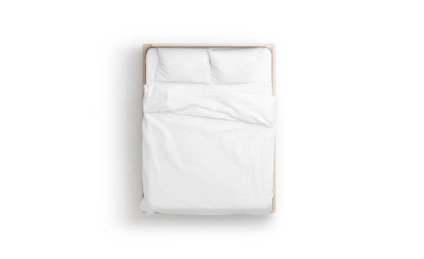 Blank white bed mock up, top view isolated, Blank white bed mock up, top view isolated, 3d rendering. Empty blanket and pillows mockup in bedstead. Doss with mattress and bedsheet in place for sleep template. Bedclothes with pilows and duvet. duvet stock pictures, royalty-free photos & images