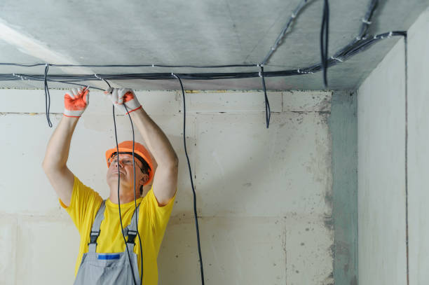 istock An electrician is fixing an electric cables. 1031493248