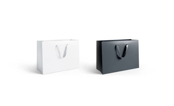 istock Blank black and white paper bag with silk handle mockup, isolated, 1031493632